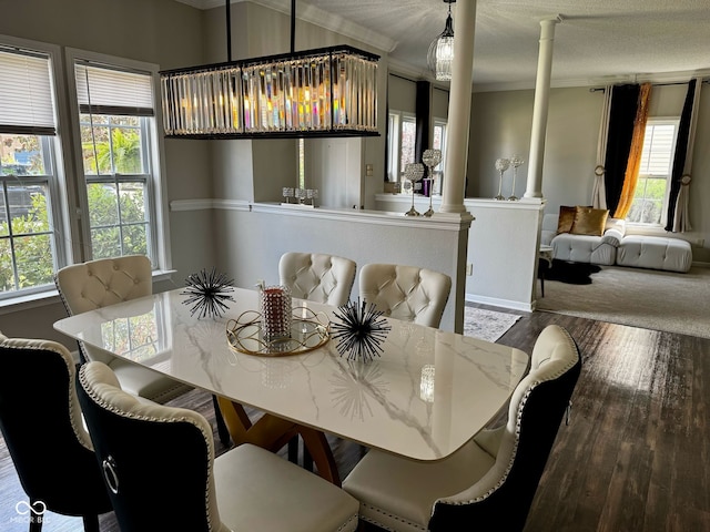 12583 Courage Xing, Fishers, IN 46037 - dining room featuring ornate columns, crown molding, healthy amount of natural light, and wood finished floors