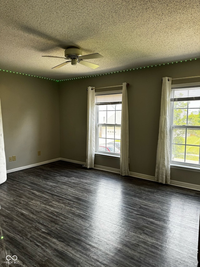 12583 Courage Xing, Fishers, IN 46037 - empty room with a textured ceiling, dark wood-style flooring, and ceiling fan