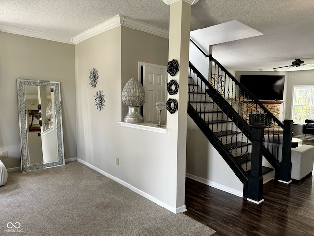 12583 Courage Xing, Fishers, IN 46037 - stairway featuring ceiling fan, a textured ceiling, crown molding, and wood finished floors