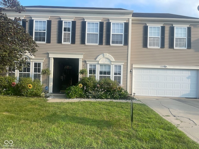 12583 Courage Xing, Fishers, IN 46037 - view of front of house with a front lawn, concrete driveway, and an attached garage