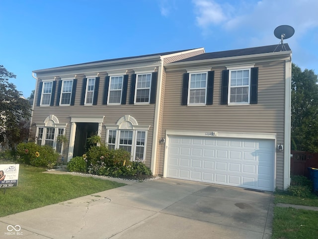 12583 Courage Xing, Fishers, IN 46037 - colonial inspired home featuring driveway, a garage, and a front lawn