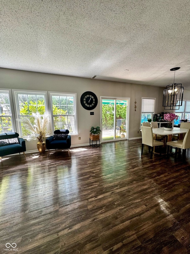 12583 Courage Xing, Fishers, IN 46037 - living area with a chandelier, wood finished floors, and a textured ceiling