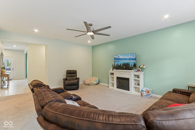 1022 Cyprian Way, Lebanon, IN 46052 - living area featuring carpet, ceiling fan, a fireplace, and recessed lighting