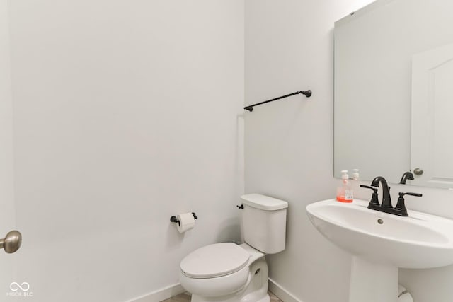 1022 Cyprian Way, Lebanon, IN 46052 - half bathroom featuring baseboards and toilet