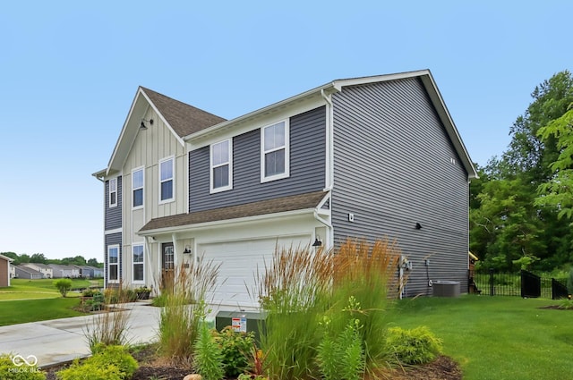 1022 Cyprian Way, Lebanon, IN 46052 - view of property exterior with board and batten siding, a garage, and driveway
