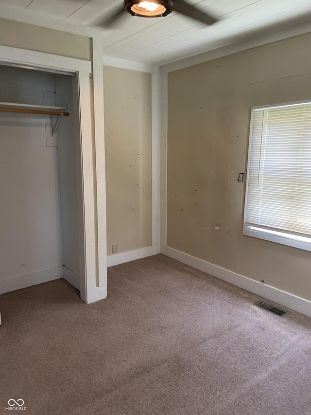 1433 S Morgantown Rd, Greenwood, IN 46143 - unfurnished bedroom with carpet, a closet, and a ceiling fan