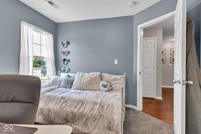 7702 Wood Stream Dr, Indianapolis, IN 46239 - carpeted bedroom featuring a textured ceiling