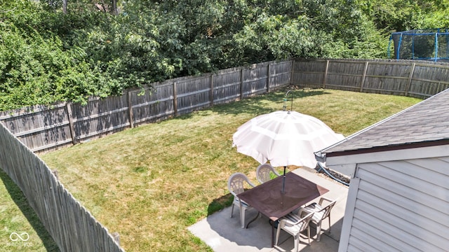 7702 Wood Stream Dr, Indianapolis, IN 46239 - fenced backyard featuring a patio area and outdoor dining space