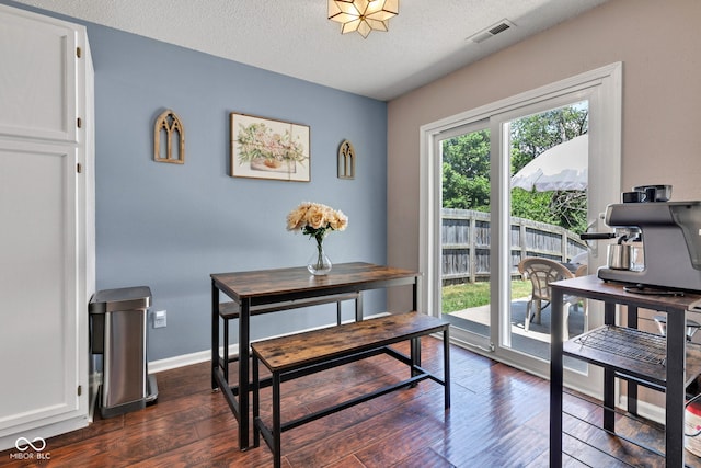 7702 Wood Stream Dr, Indianapolis, IN 46239 - dining space featuring dark wood-type flooring and a textured ceiling