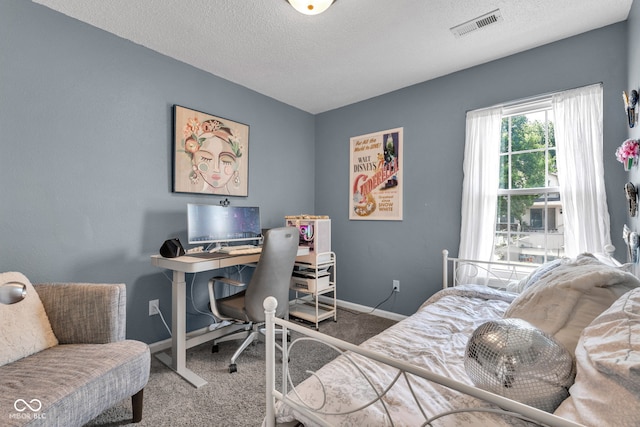 7702 Wood Stream Dr, Indianapolis, IN 46239 - carpeted bedroom featuring a textured ceiling and a desk