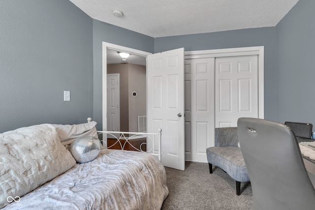 7702 Wood Stream Dr, Indianapolis, IN 46239 - carpeted bedroom with a closet and a textured ceiling