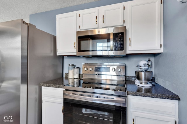 7702 Wood Stream Dr, Indianapolis, IN 46239 - kitchen featuring stainless steel appliances and white cabinetry