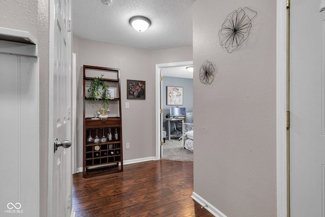 7702 Wood Stream Dr, Indianapolis, IN 46239 - corridor with wood finished floors, a textured ceiling, and an office area