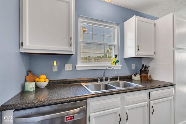 7702 Wood Stream Dr, Indianapolis, IN 46239 - kitchen featuring stainless steel dishwasher, white cabinets, and dark countertops