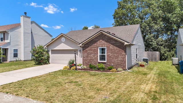 7702 Wood Stream Dr, Indianapolis, IN 46239 - view of front of home with brick siding, concrete driveway, an attached garage, and roof with shingles