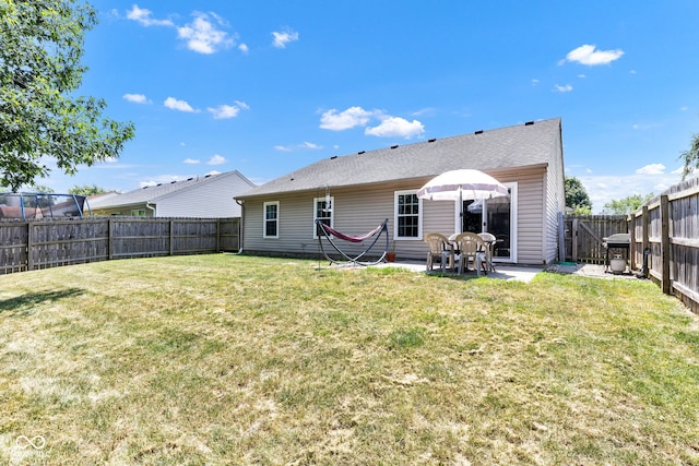 7702 Wood Stream Dr, Indianapolis, IN 46239 - rear view of house with a fenced backyard and a patio