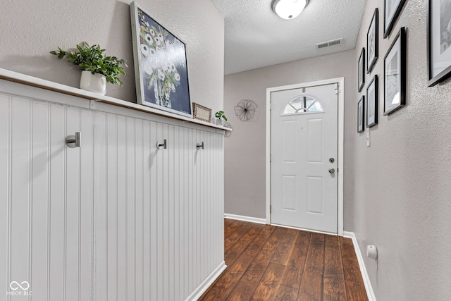 7702 Wood Stream Dr, Indianapolis, IN 46239 - foyer with dark wood-style floors and a textured ceiling