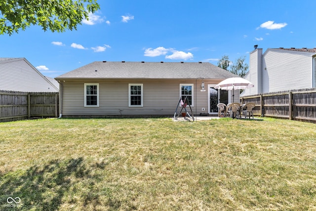 7702 Wood Stream Dr, Indianapolis, IN 46239 - back of property featuring a fenced backyard and a patio area