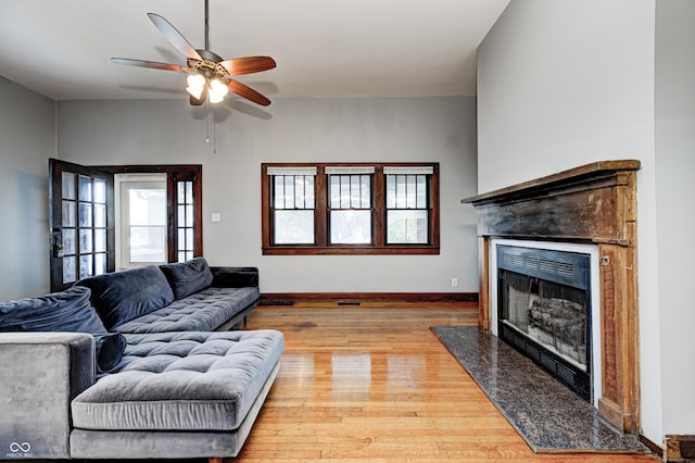 832 Noble St, Indianapolis, IN 46203 - living area with a high end fireplace, a ceiling fan, and wood finished floors