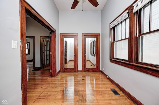 832 Noble St, Indianapolis, IN 46203 - hall with light wood-style floors and french doors