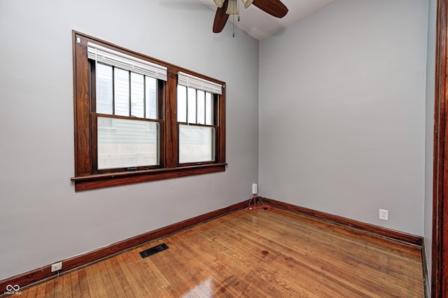 832 Noble St, Indianapolis, IN 46203 - empty room with ceiling fan, hardwood / wood-style floors, and vaulted ceiling