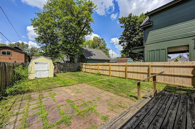 832 Noble St, Indianapolis, IN 46203 - fenced backyard featuring a shed, a patio area, and a wooden deck