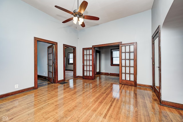 832 Noble St, Indianapolis, IN 46203 - spare room with french doors, light wood finished floors, and ceiling fan