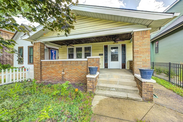 832 Noble St, Indianapolis, IN 46203 - view of exterior entry featuring ceiling fan, a porch, and brick siding