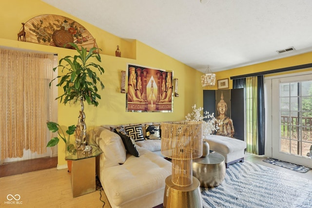 6117 Salanie Pl, Indianapolis, IN 46254 - living area with wood finished floors, lofted ceiling, and a chandelier