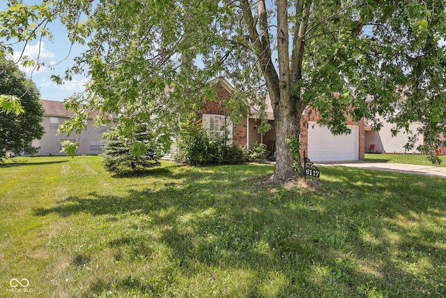6117 Salanie Pl, Indianapolis, IN 46254 - obstructed view of property with brick siding, driveway, and a front yard