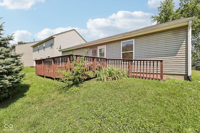 6117 Salanie Pl, Indianapolis, IN 46254 - rear view of property featuring a wooden deck and a lawn