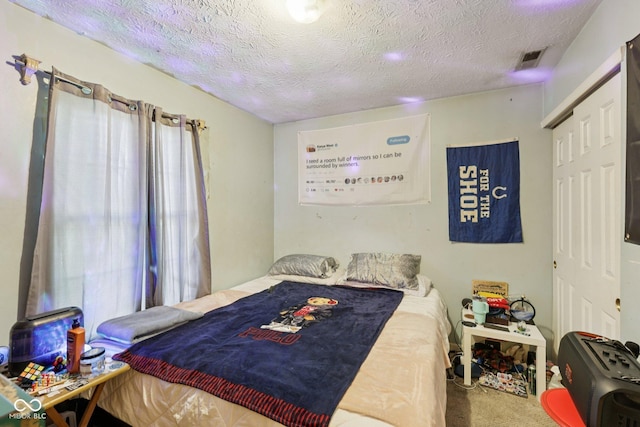 6117 Salanie Pl, Indianapolis, IN 46254 - carpeted bedroom featuring a textured ceiling and a closet