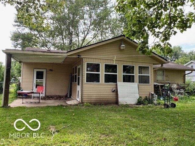 4845 Timbercrest Dr, Columbus, IN 47203 - back of house with a yard and a patio area