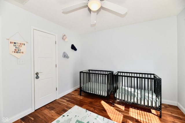114 Sunrise Ln, Lizton, IN 46149 - bedroom featuring wood finished floors, a nursery area, and ceiling fan