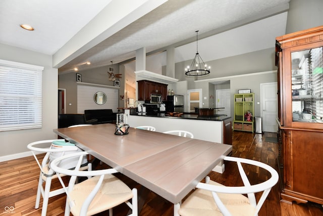 114 Sunrise Ln, Lizton, IN 46149 - dining room with dark wood finished floors, a chandelier, ceiling fan, recessed lighting, and high vaulted ceiling