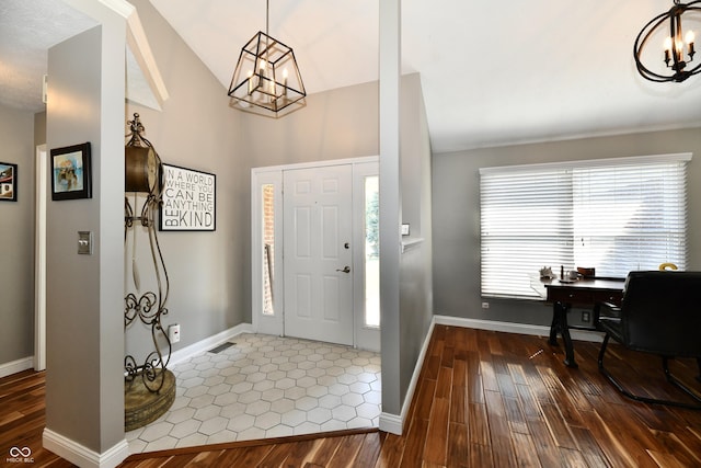 114 Sunrise Ln, Lizton, IN 46149 - entryway featuring a chandelier, wood finished floors, and vaulted ceiling