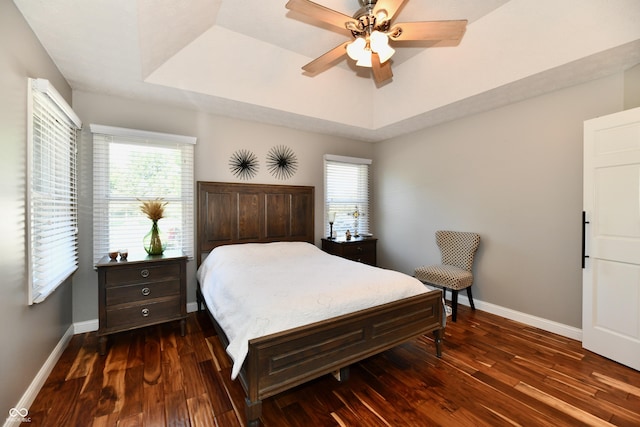 114 Sunrise Ln, Lizton, IN 46149 - bedroom with dark wood-type flooring, a raised ceiling, and ceiling fan