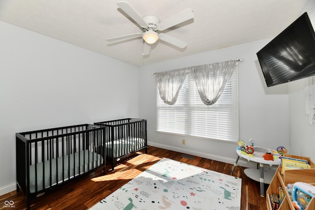 114 Sunrise Ln, Lizton, IN 46149 - bedroom featuring wood finished floors, a crib, and ceiling fan