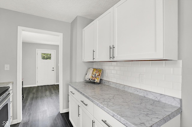 3664 S 550 E, Franklin, IN 46131 - kitchen with dark wood-style floors, decorative backsplash, white cabinetry, stainless steel electric range, and a textured ceiling