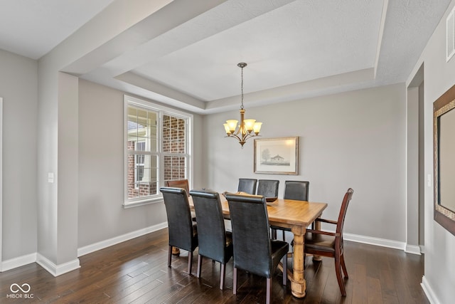 16338 Portage Trail Ln, Fortville, IN 46040 - dining area featuring a tray ceiling, dark wood-style floors, and a chandelier