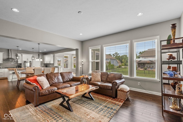 16338 Portage Trail Ln, Fortville, IN 46040 - living area featuring dark wood finished floors and recessed lighting
