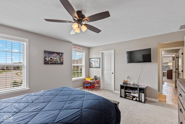 16338 Portage Trail Ln, Fortville, IN 46040 - bedroom with light colored carpet, a textured ceiling, and a ceiling fan