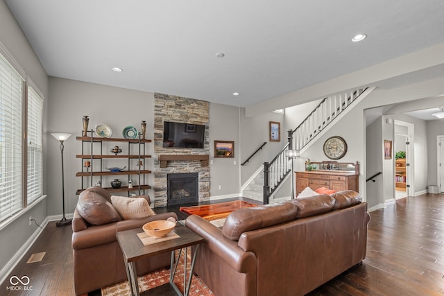 16338 Portage Trail Ln, Fortville, IN 46040 - living room with stairway, a stone fireplace, dark wood-style floors, and recessed lighting