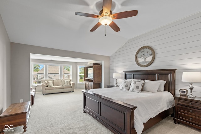 16338 Portage Trail Ln, Fortville, IN 46040 - bedroom with vaulted ceiling, light carpet, wooden walls, and a ceiling fan