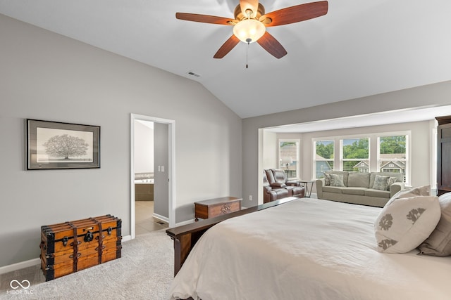 16338 Portage Trail Ln, Fortville, IN 46040 - carpeted bedroom featuring vaulted ceiling, ensuite bath, and a ceiling fan