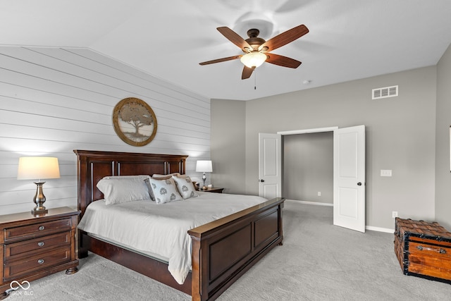 16338 Portage Trail Ln, Fortville, IN 46040 - bedroom with light colored carpet, lofted ceiling, wood walls, and a ceiling fan
