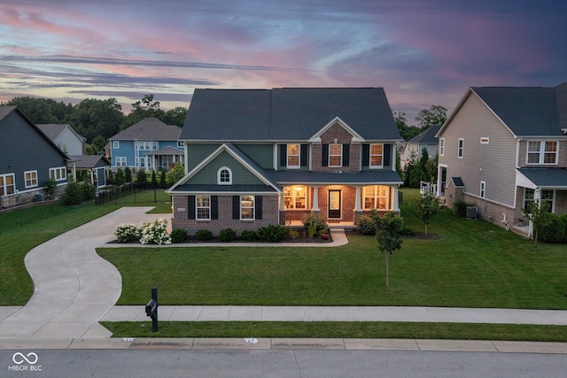 16338 Portage Trail Ln, Fortville, IN 46040 - view of front of property featuring driveway, a yard, brick siding, and a residential view