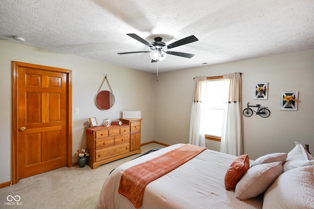 4001 Oakfield Dr, Indianapolis, IN 46237 - bedroom with light carpet, a ceiling fan, and a textured ceiling