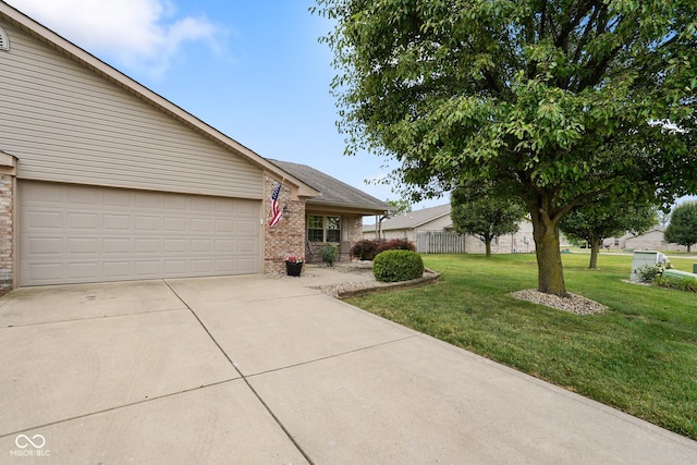 4001 Oakfield Dr, Indianapolis, IN 46237 - view of front facade with brick siding, driveway, and a garage