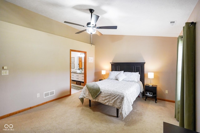 4001 Oakfield Dr, Indianapolis, IN 46237 - bedroom with light colored carpet, ensuite bath, and ceiling fan